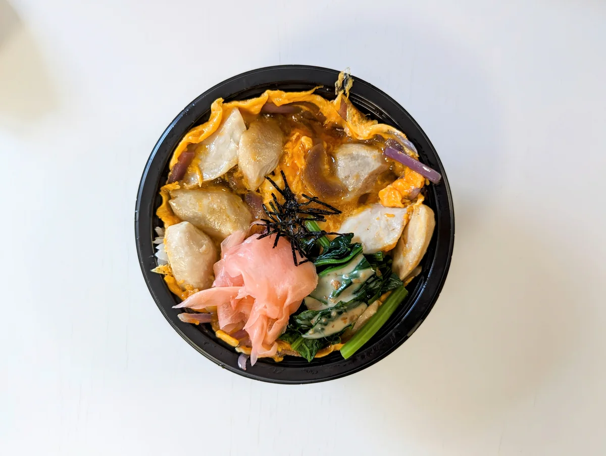 Shokudō oyako don from above — chicken and soft egg over rice with pickled ginger, greens and nori