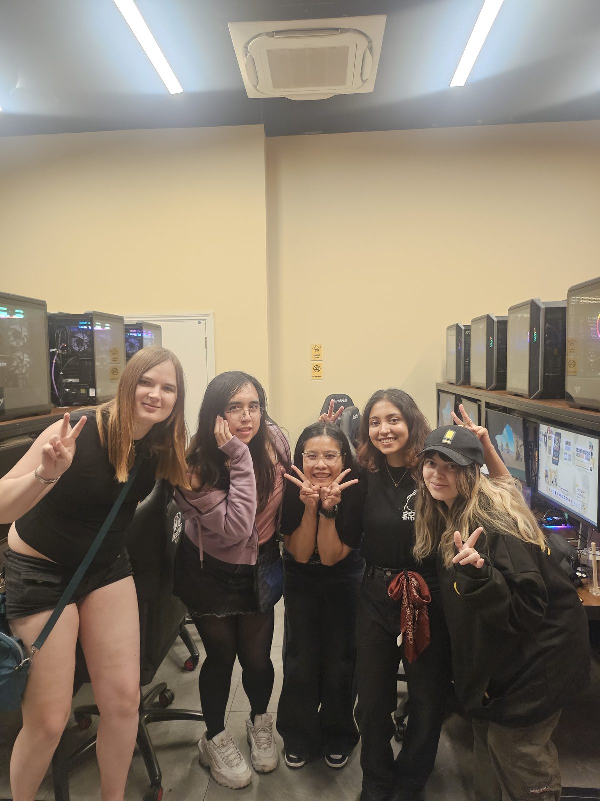 Friends posing at a gaming social