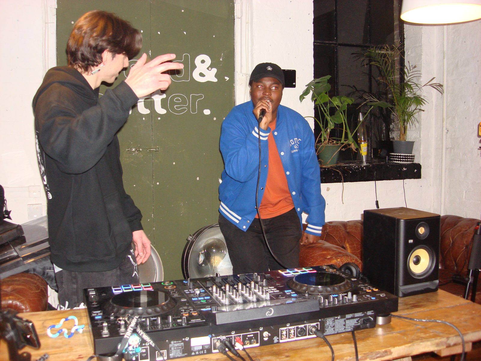 Attendee singing on a microphone at a social