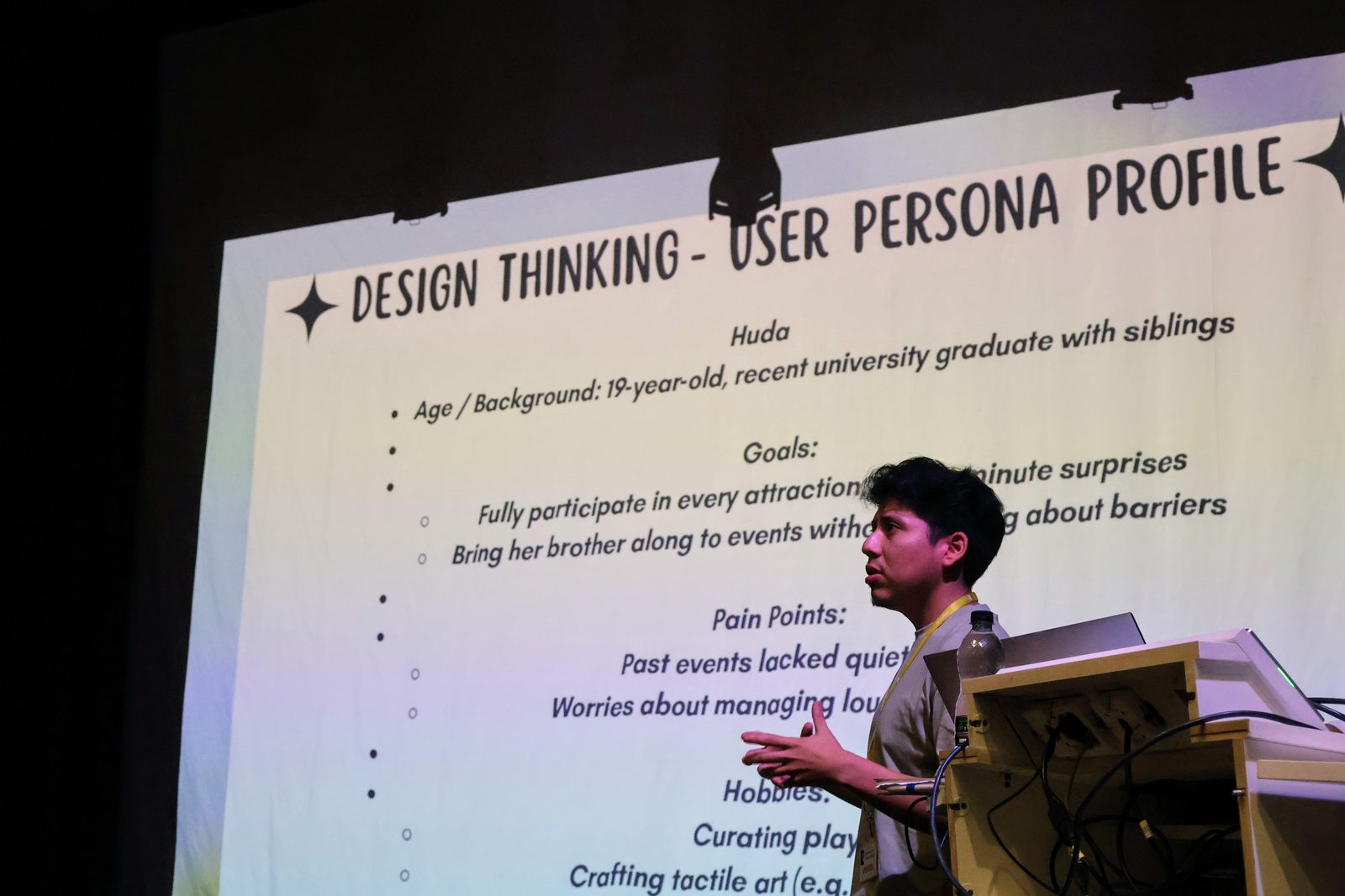 A speaker presenting to the Ambifest team