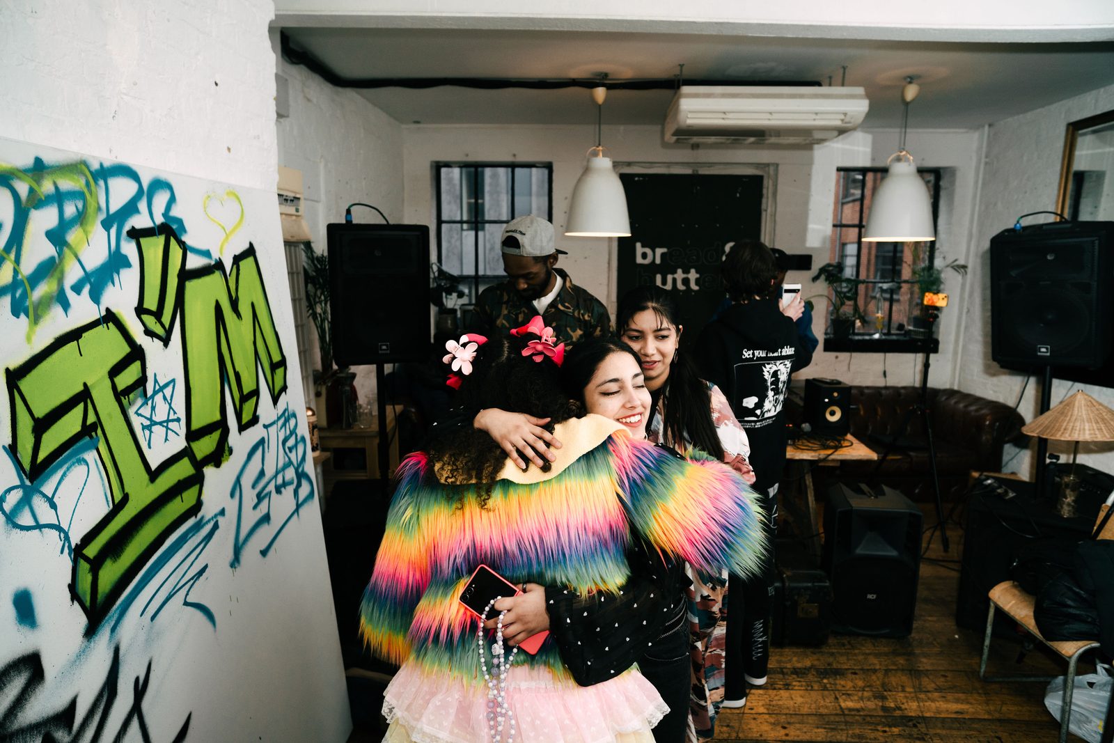 Friends hugging at an Ambifest event